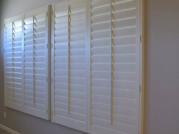 A Closed White Wooden Plantation Shutters